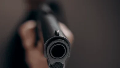 man aiming shooting gun focus 600nw 2313146299